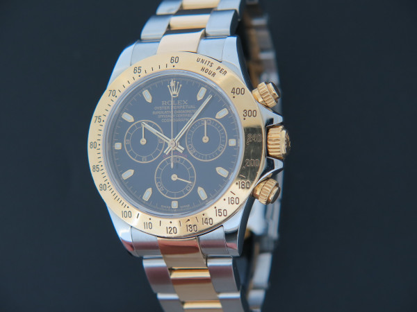 Rolex - Daytona Gold/Steel Black Dial 116523